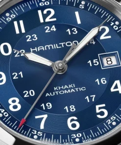 Descubre el Hamilton Khaki Field Automatic 42 mm (ref. H70605540): reloj automático suizo con esfera azul sunray y efecto snailing, movimiento H‑10 (80 h reserva de marcha), resistencia 100 m, cristal de zafiro, resorte Nivachron, Super‑LumiNova y fondo abierto. Estilo militar moderno con precisión fiable.