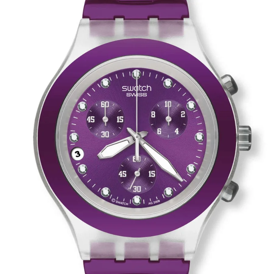 Primer plano de la esfera violeta del Swatch SVCK4048AG, con tres contadores, marcas plateadas y fecha a las 9